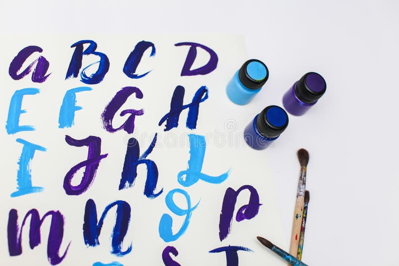 Calligraphy lettering alphabet drawn with dry brush. Letters of English ABC written with paint brush. Concept hobby or education royalty free stock images